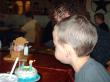 Tyler helping Daniel blow out the candles