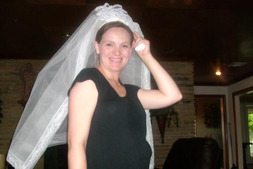 Kelli tries on Gracie's veil